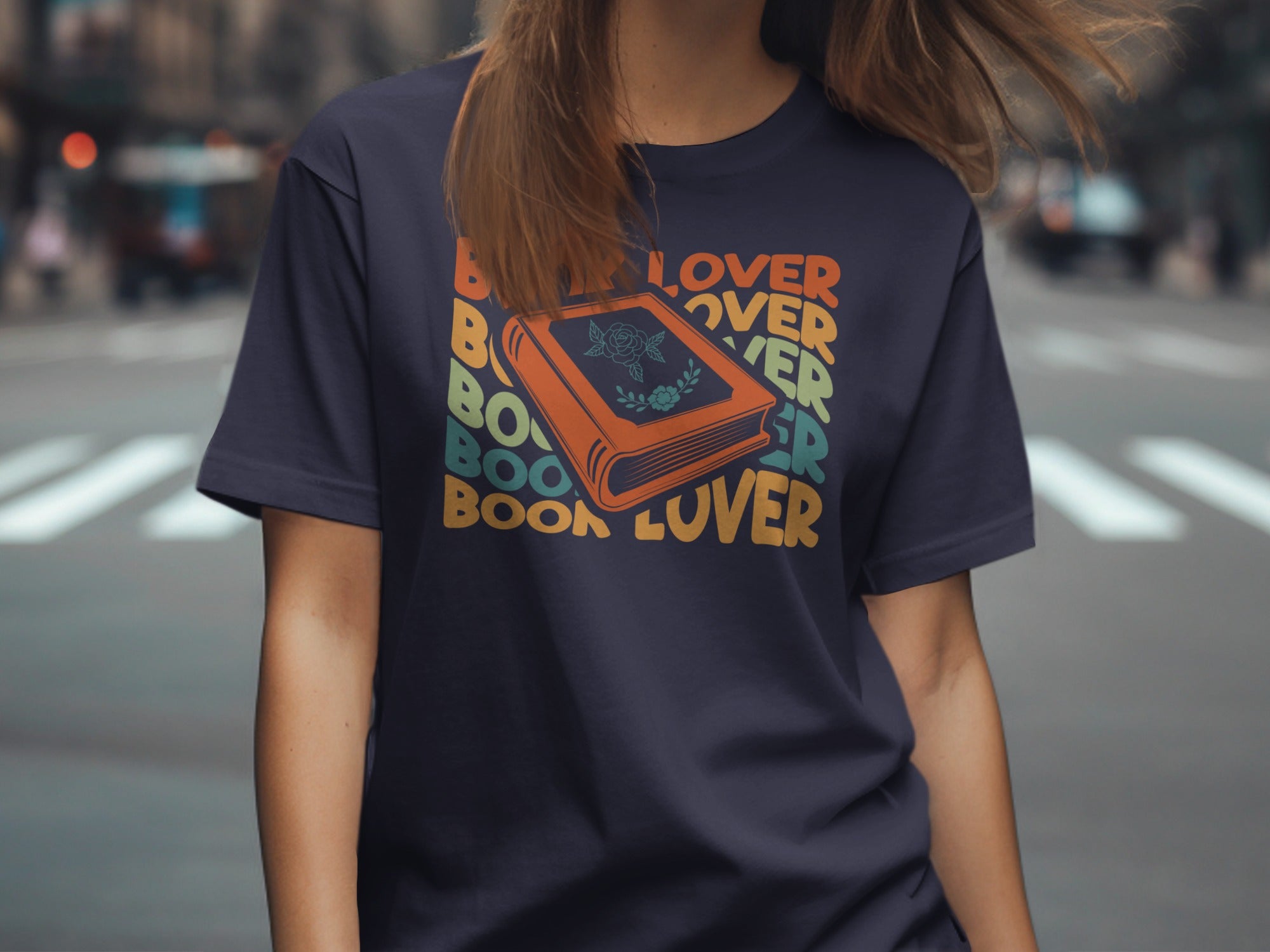 Dark t-shirt with stacked "Book Lover" text and an orange book graphic.