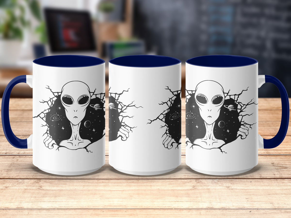 Three white mugs with blue handles and rims, featuring an alien design.