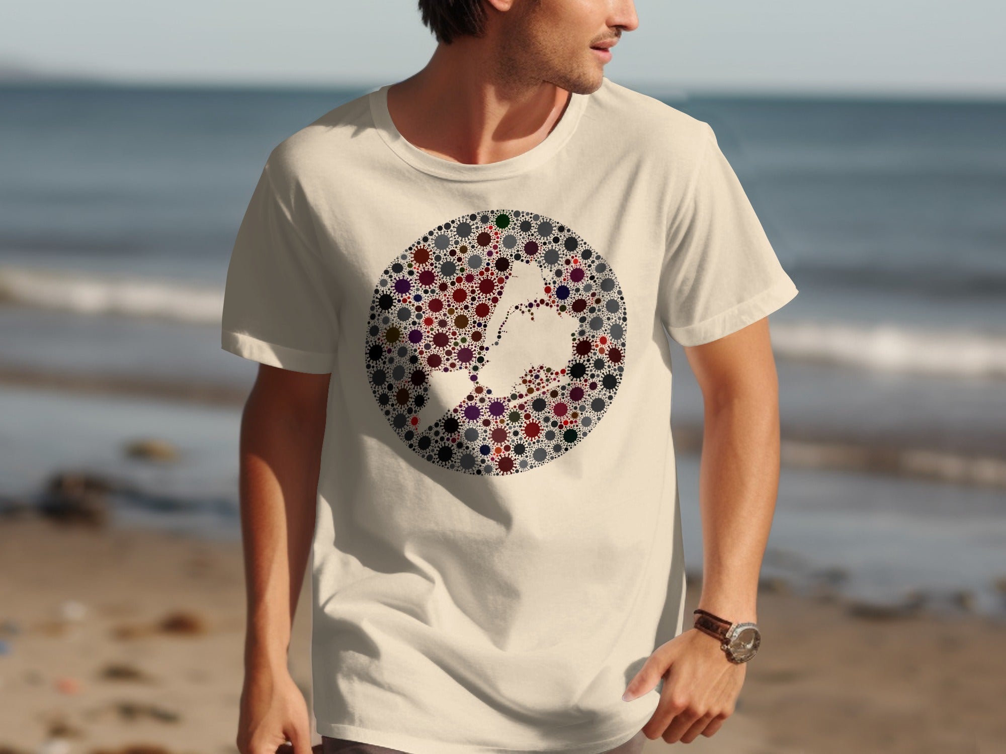 Cream t-shirt with a circle design of colorful virus-like shapes forming a map outline.