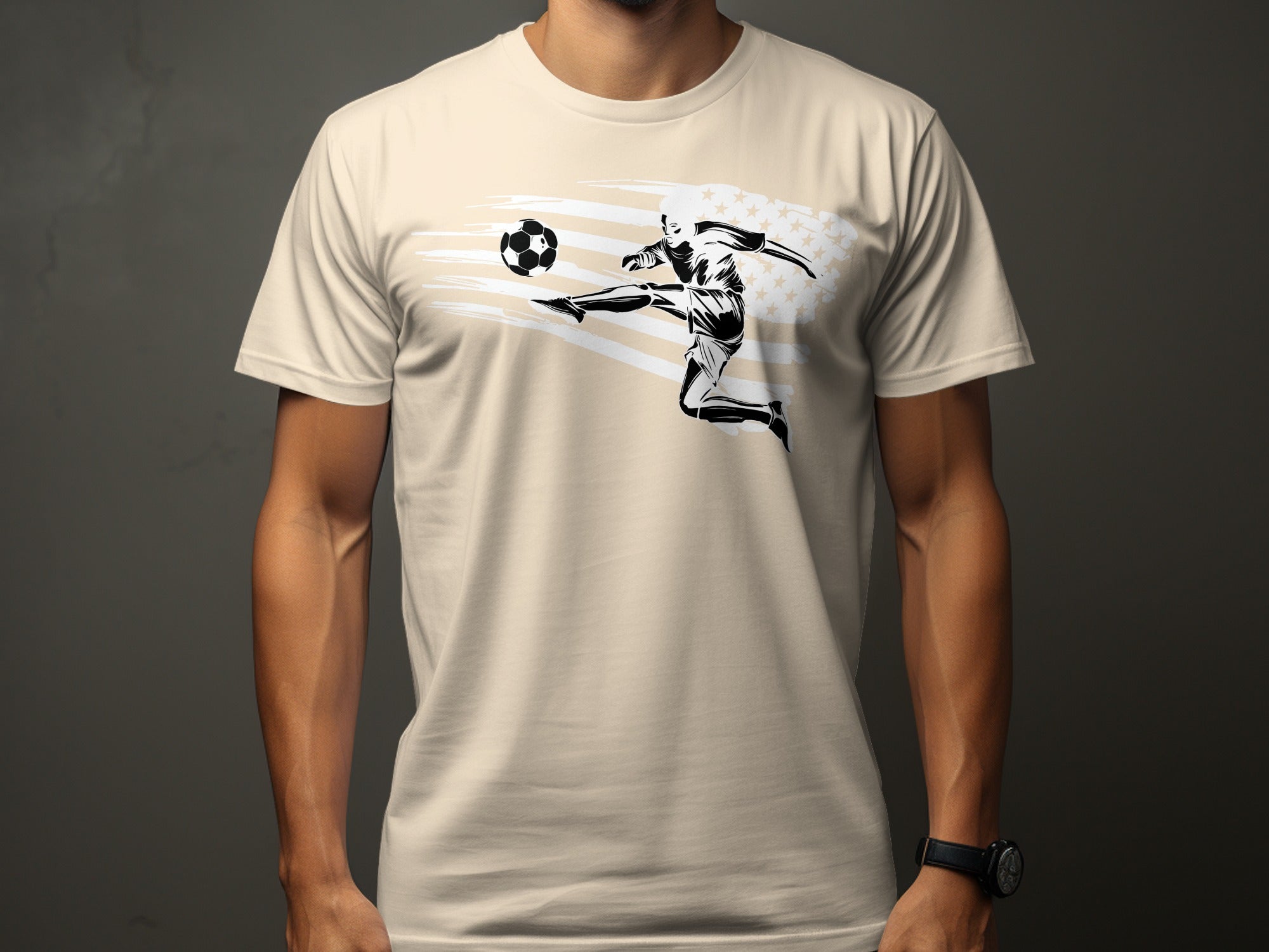 Cream t-shirt with black graphic of soccer player kicking ball over American flag design.