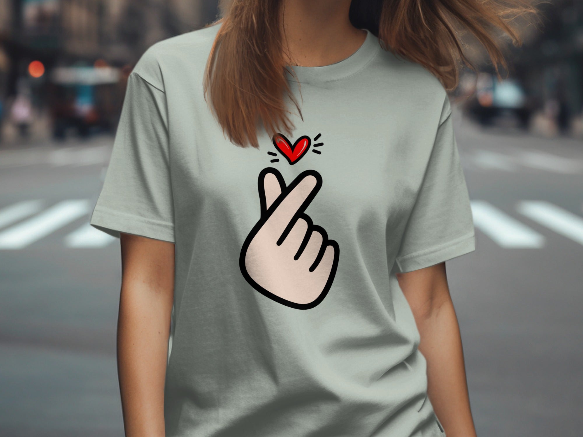 Grey t-shirt with a hand forming a heart shape and red heart icon.
