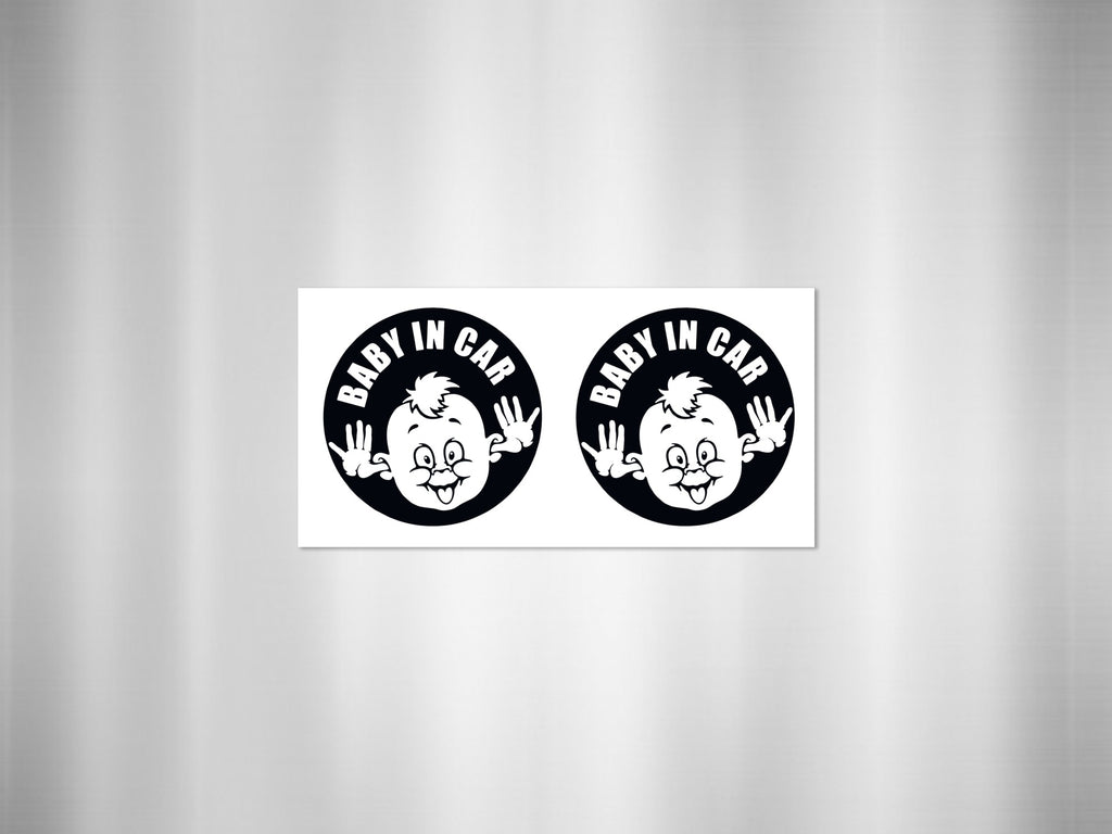 Two black and white "Baby In Car" circular decals featuring a cartoon baby's face.