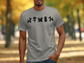 Grey t-shirt with black balloon animal graphics of a dog, flower, butterfly, bunny, and poodle.