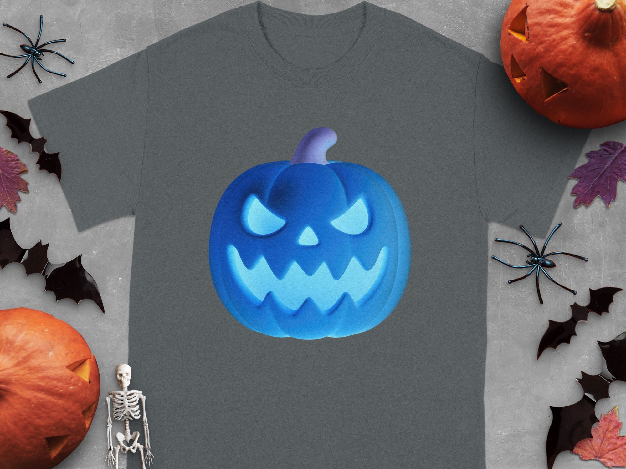 Gray t-shirt with a glowing blue jack-o'-lantern graphic and surrounding Halloween decorations.