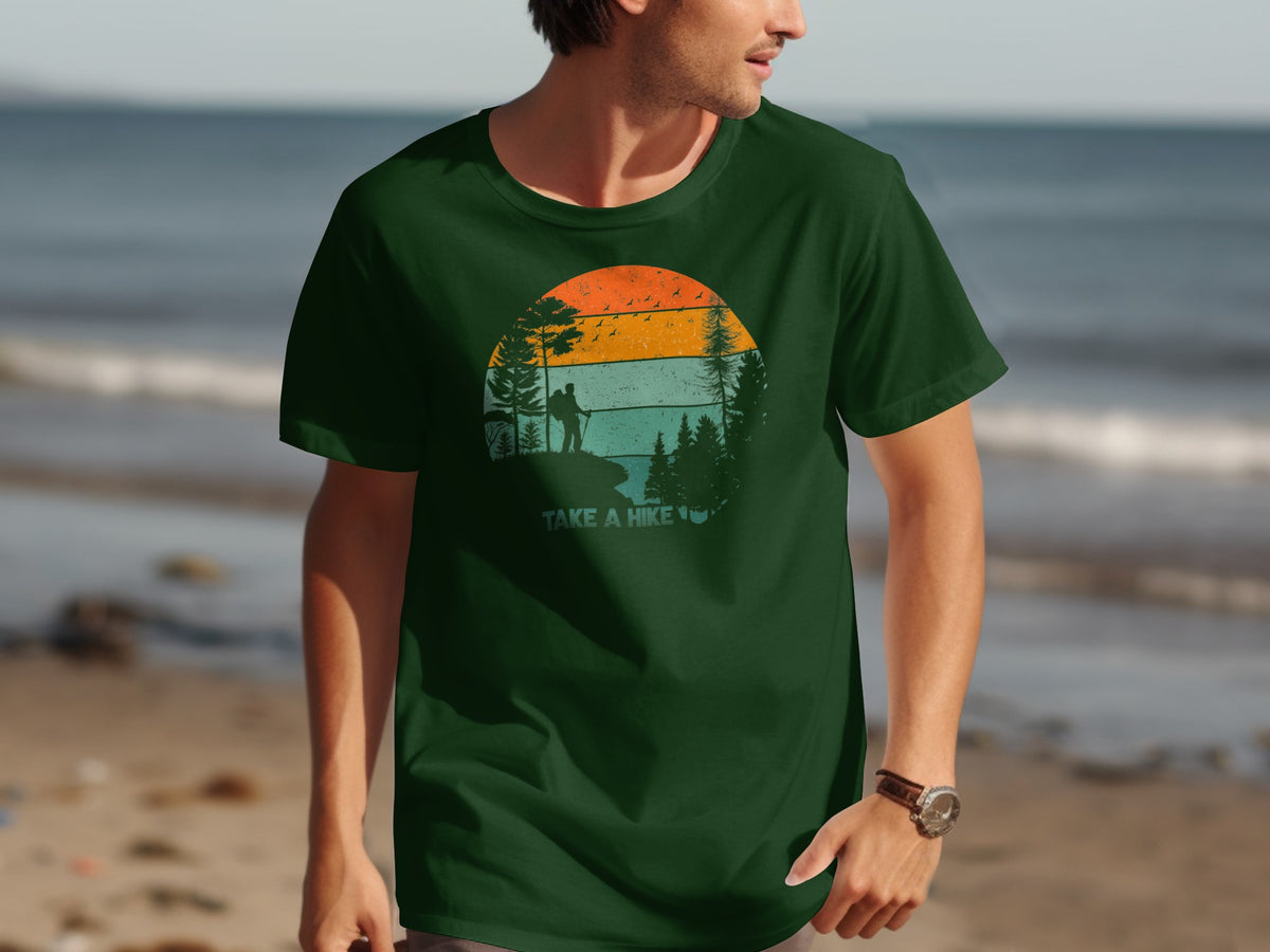 Green t-shirt with a vintage sunset hiking graphic and text "TAKE A HIKE".