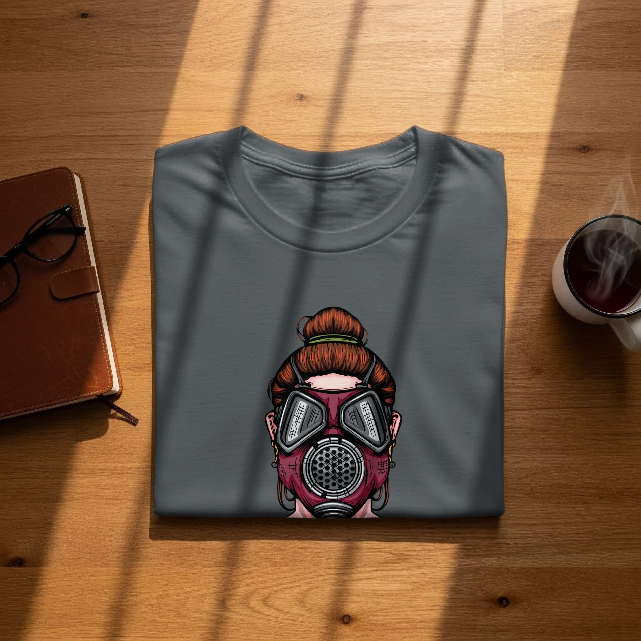 Gray t-shirt with a graphic of a woman wearing a gas mask.