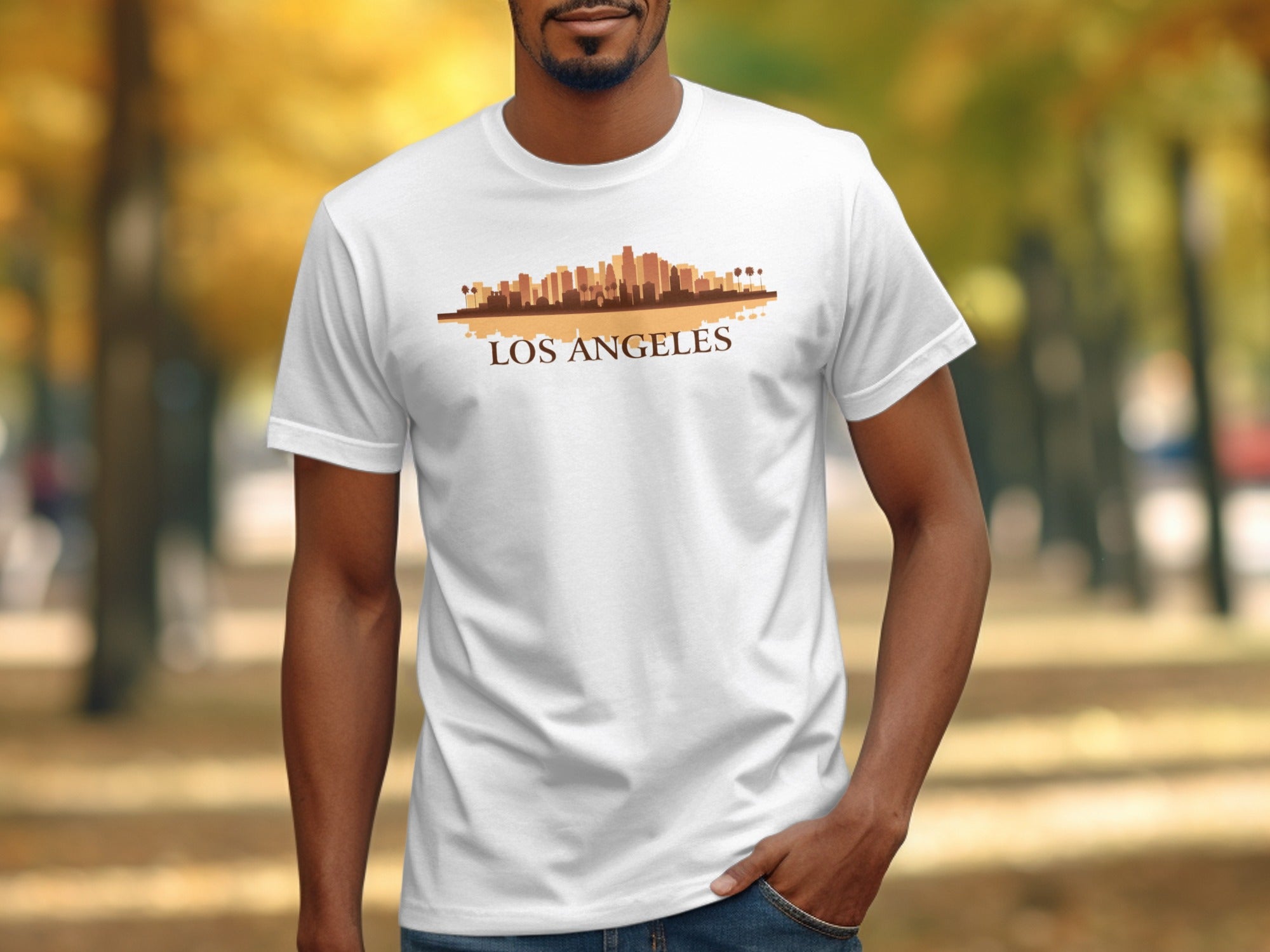 White t-shirt with a Los Angeles skyline graphic and palm trees.