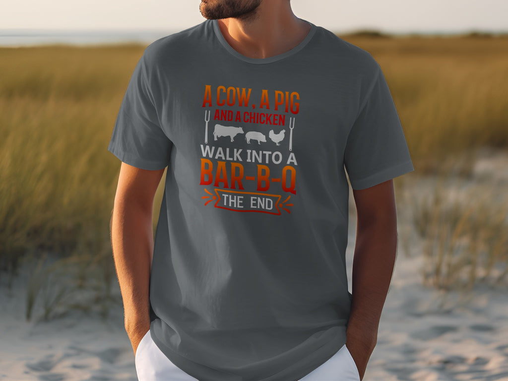 Dark gray t-shirt with the text "A cow, a pig, and a chicken walk into a bar-b-q, the end."