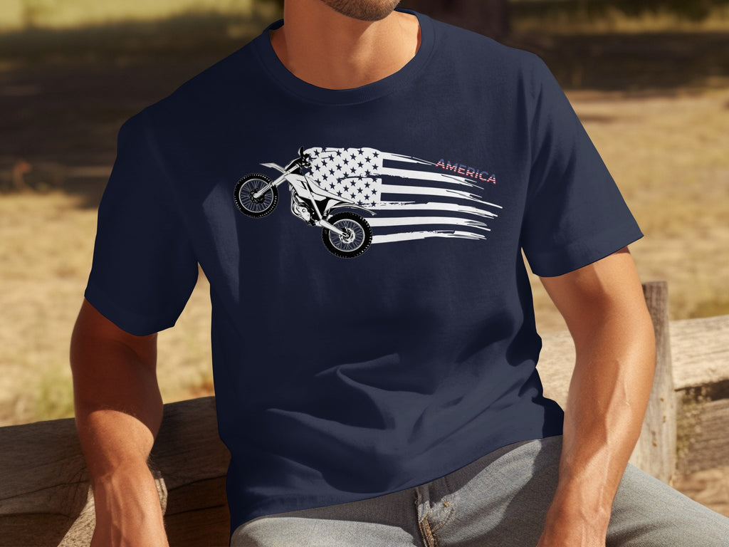 Motocross bike graphic on a navy blue t-shirt with American flag elements and the word "AMERICA".