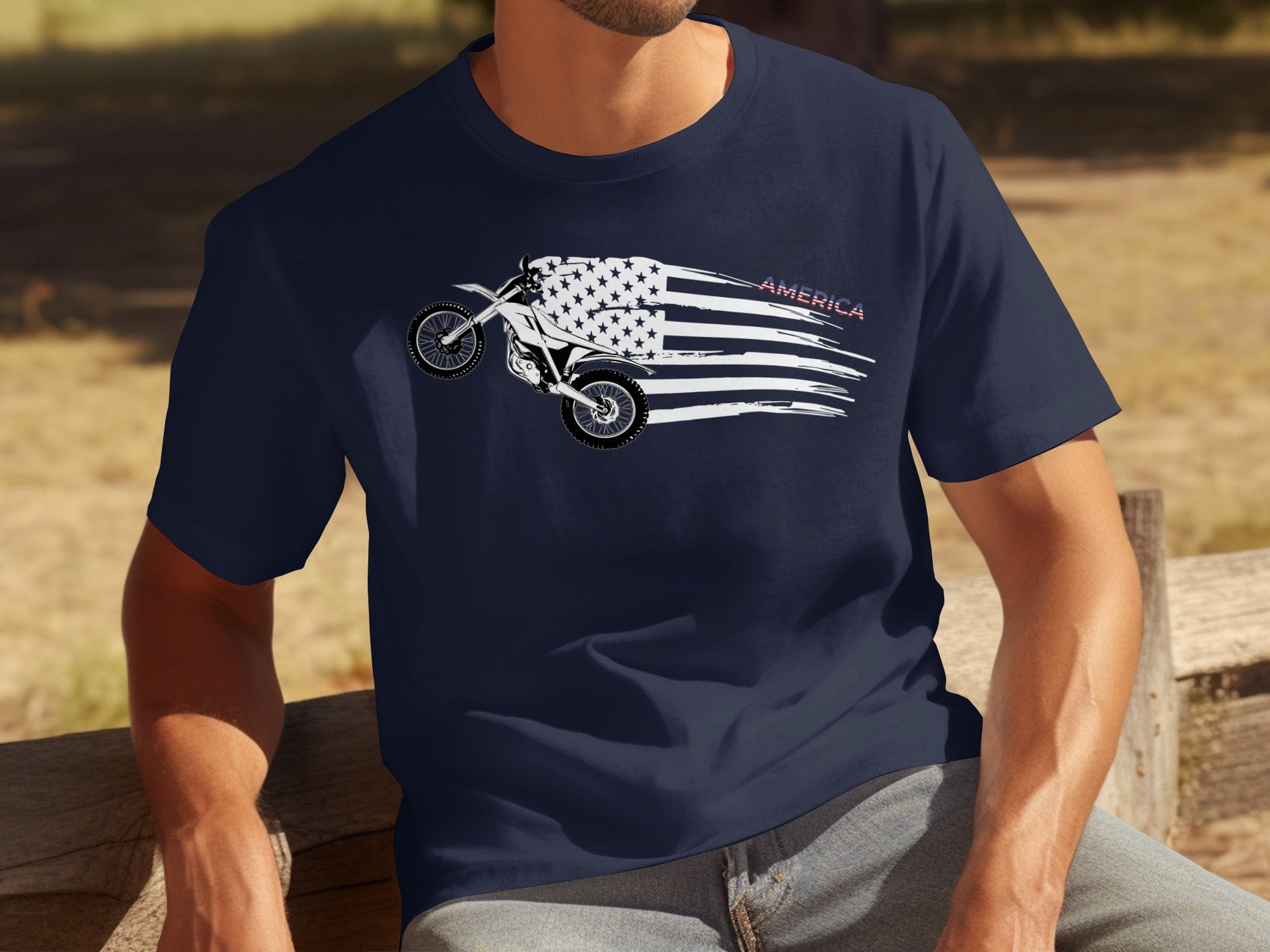 Motocross bike graphic on a navy blue t-shirt with American flag elements and the word "AMERICA".