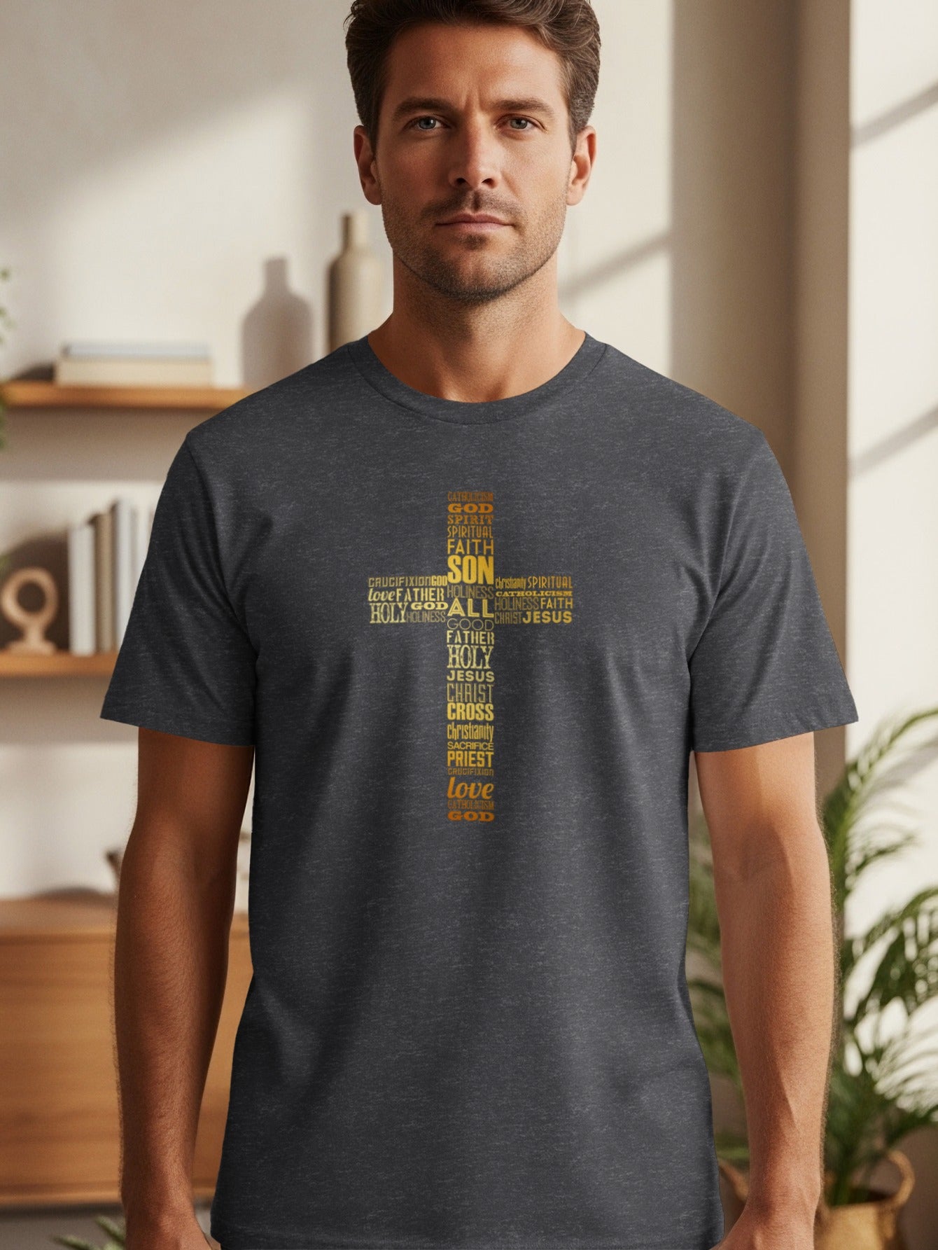 Man wearing dark t-shirt with a yellow word cloud cross featuring religious terms.