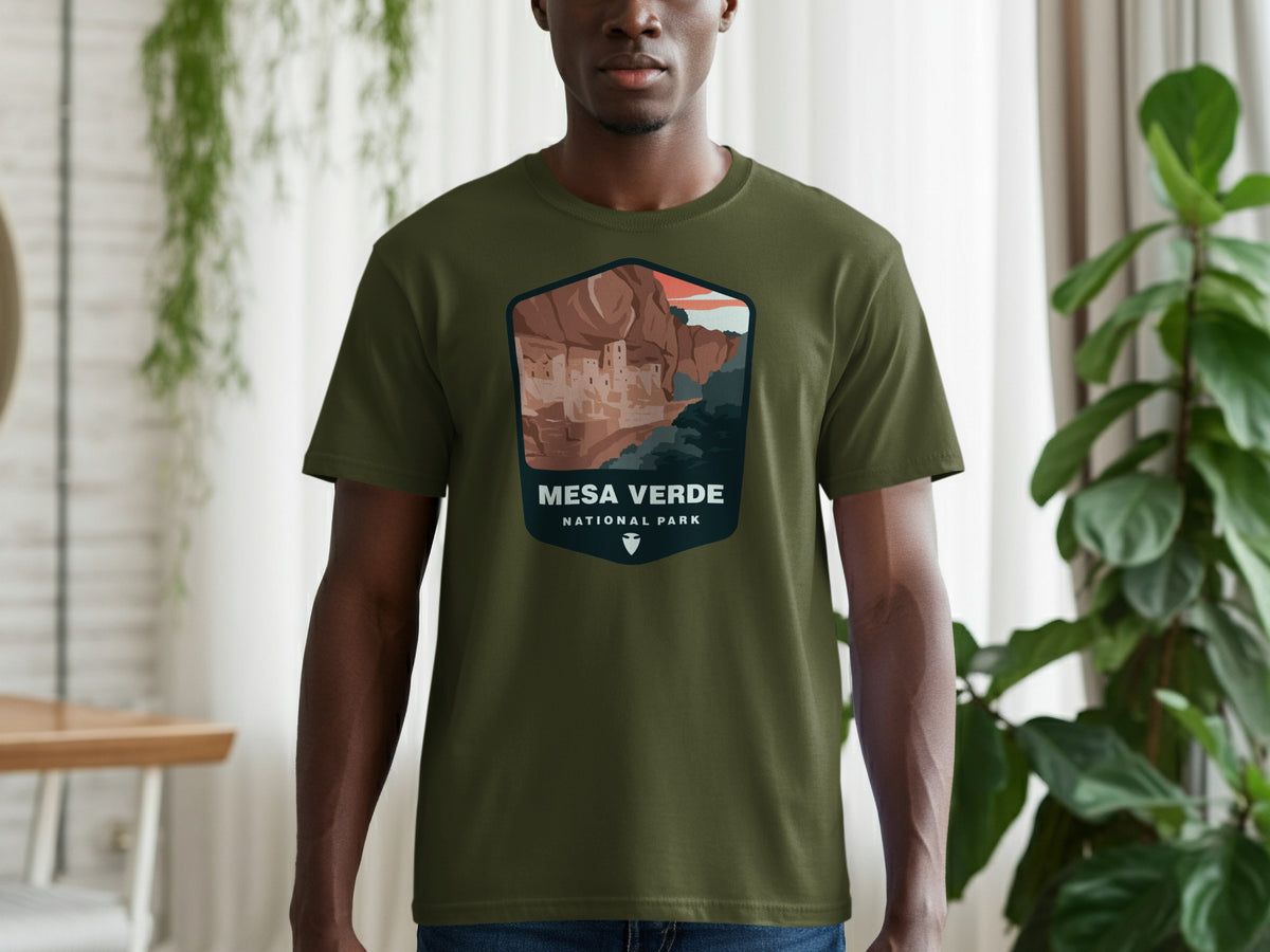 Olive green t-shirt featuring Mesa Verde National Park cliff dwellings graphic.