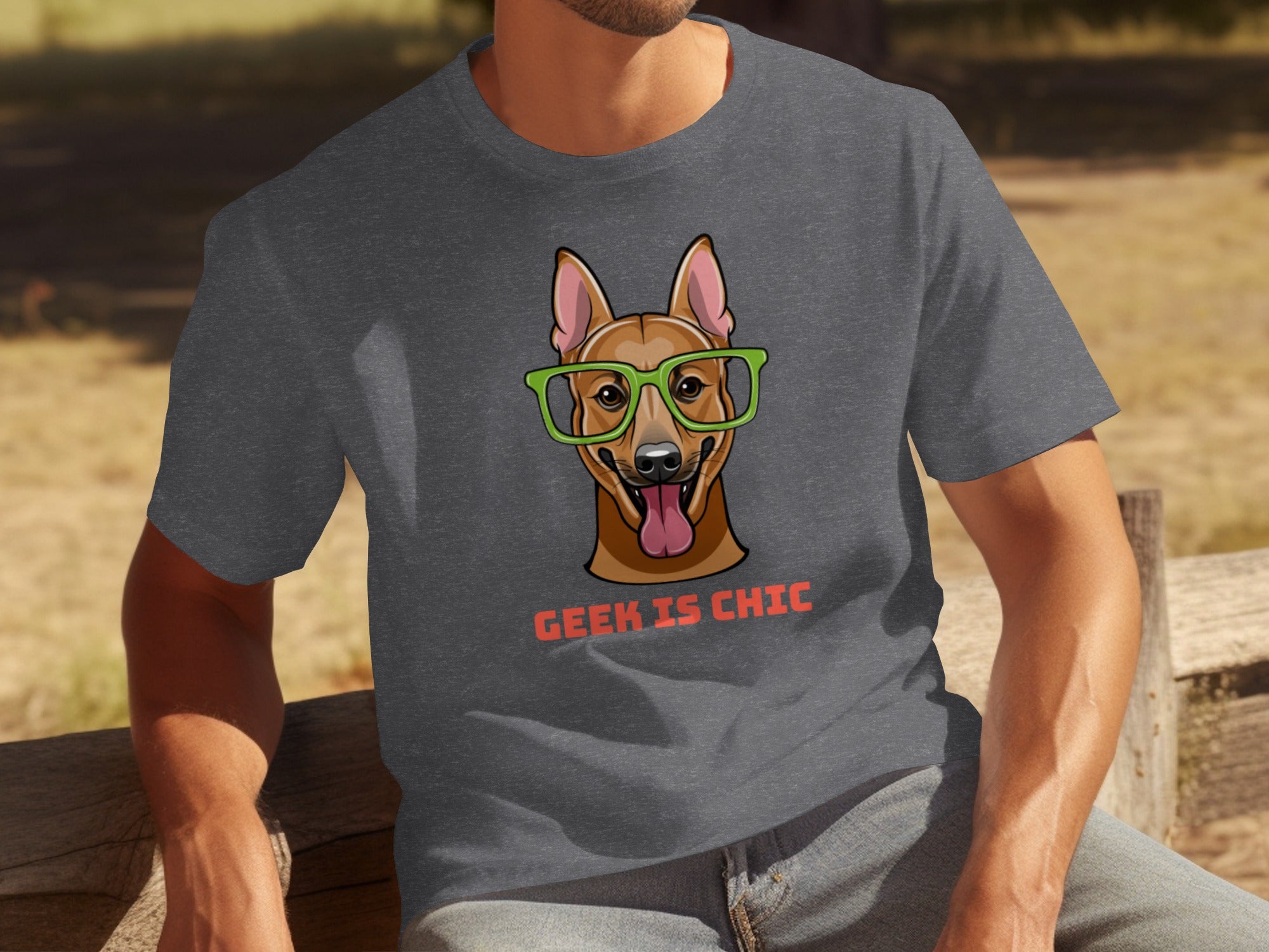 Dark grey t-shirt with cartoon dog wearing green glasses and text "Geek is Chic."