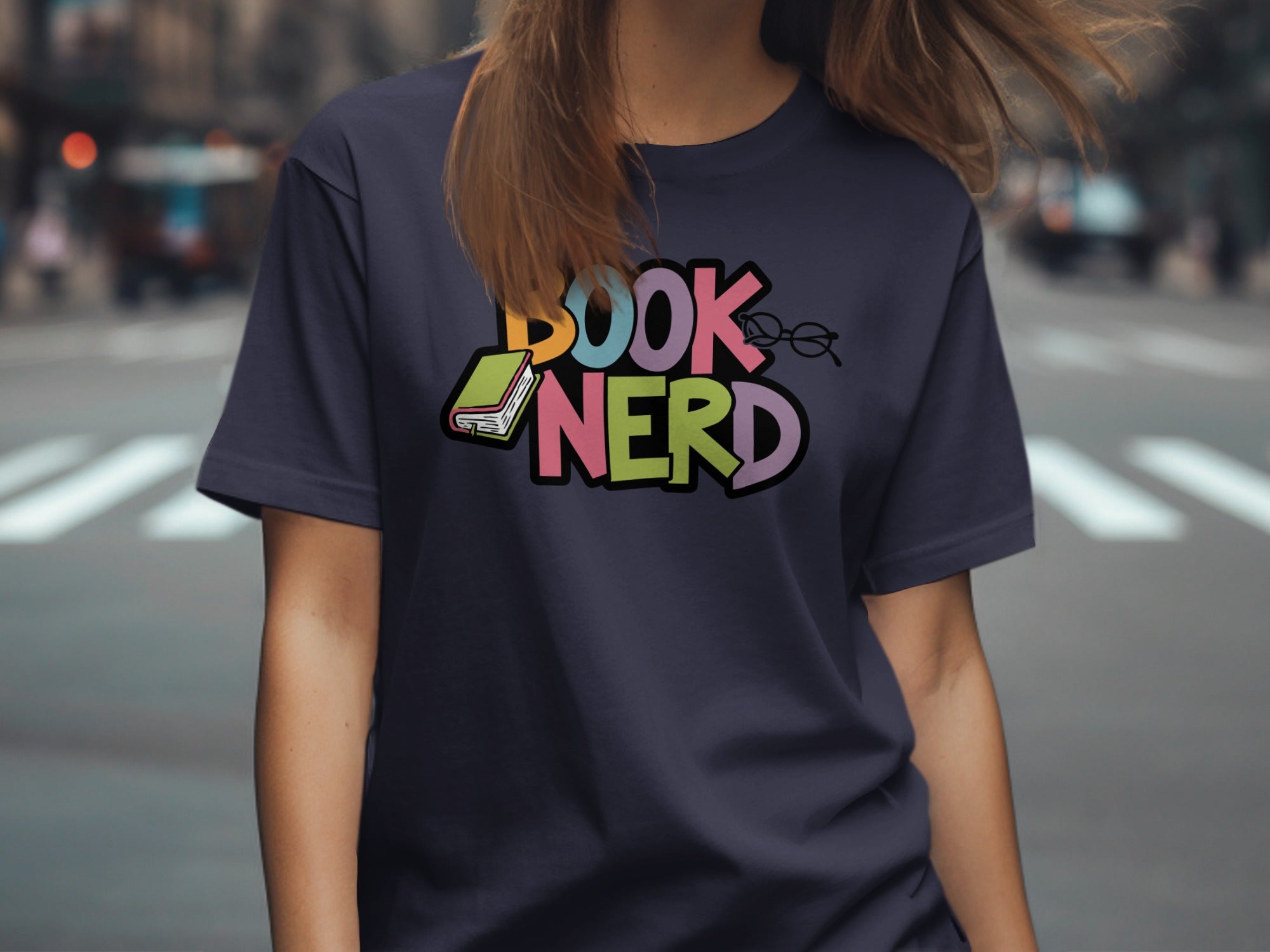 Dark blue t-shirt with colorful "BOOK NERD" text and an open book.