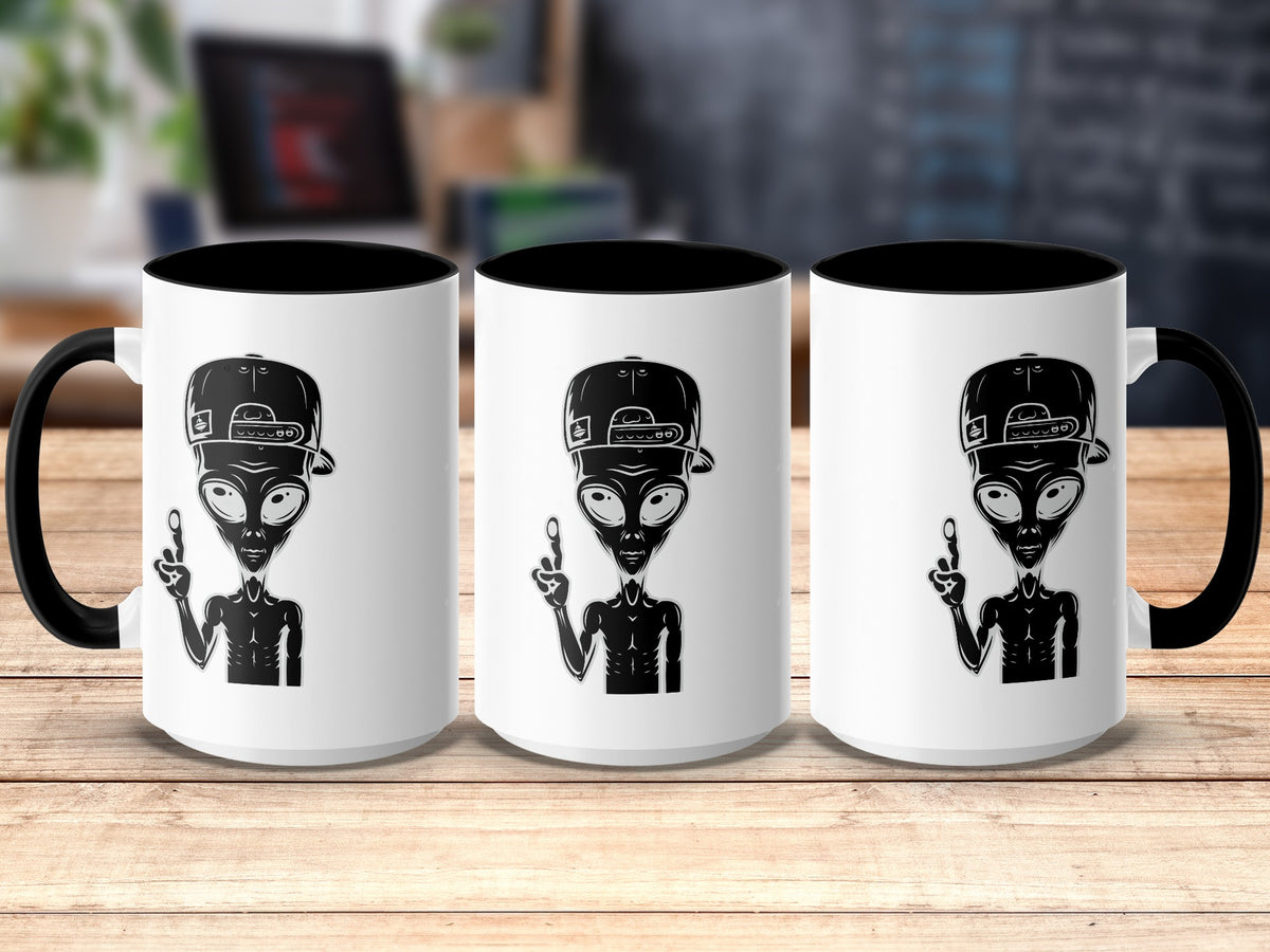 Three white mugs with black handles, each featuring a black alien wearing a baseball cap.