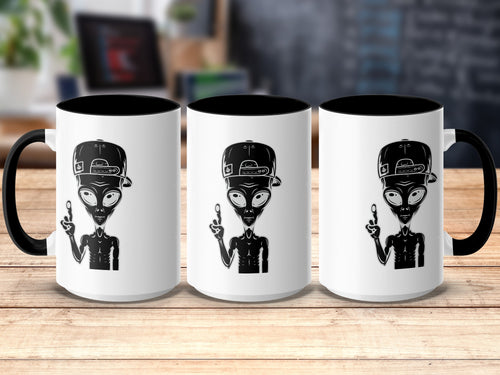 Three white mugs with black handles, each featuring a black alien wearing a baseball cap.