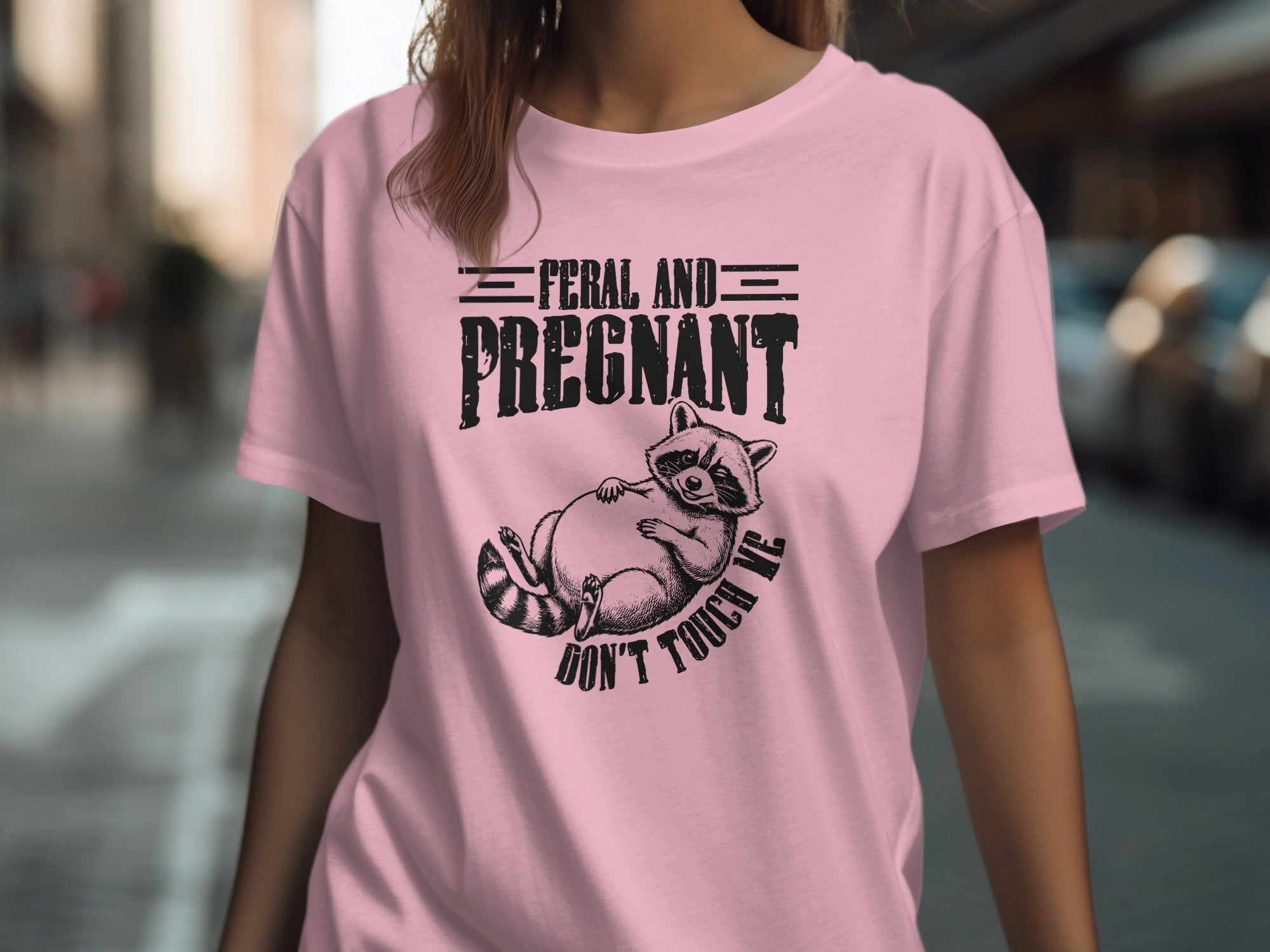 Pink t-shirt with "Feral and Pregnant" text, and a raccoon graphic saying "Don't Touch Me".