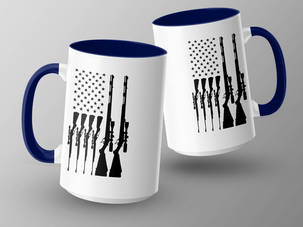 Two white mugs with navy blue handles and rims, featuring silhouettes of rifles against an American flag design.