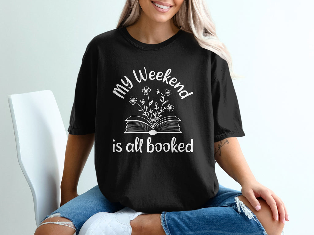Black t-shirt with "my Weekend is all booked" and book with flowers graphic.