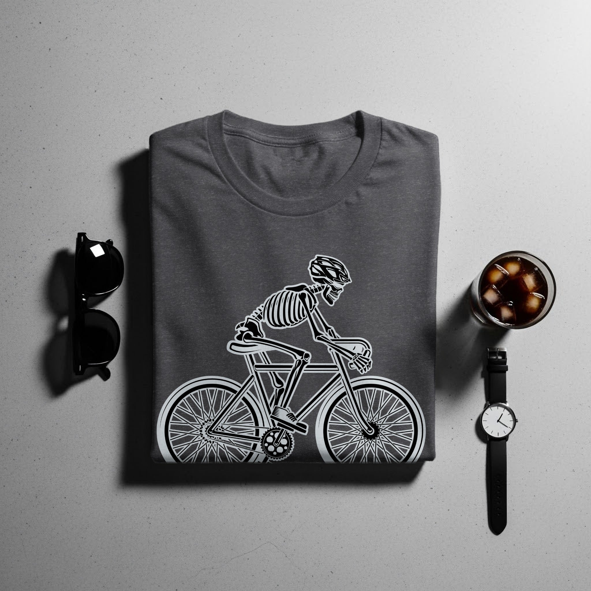 Dark grey t-shirt with a white skeleton cyclist design, sunglasses, and watch.