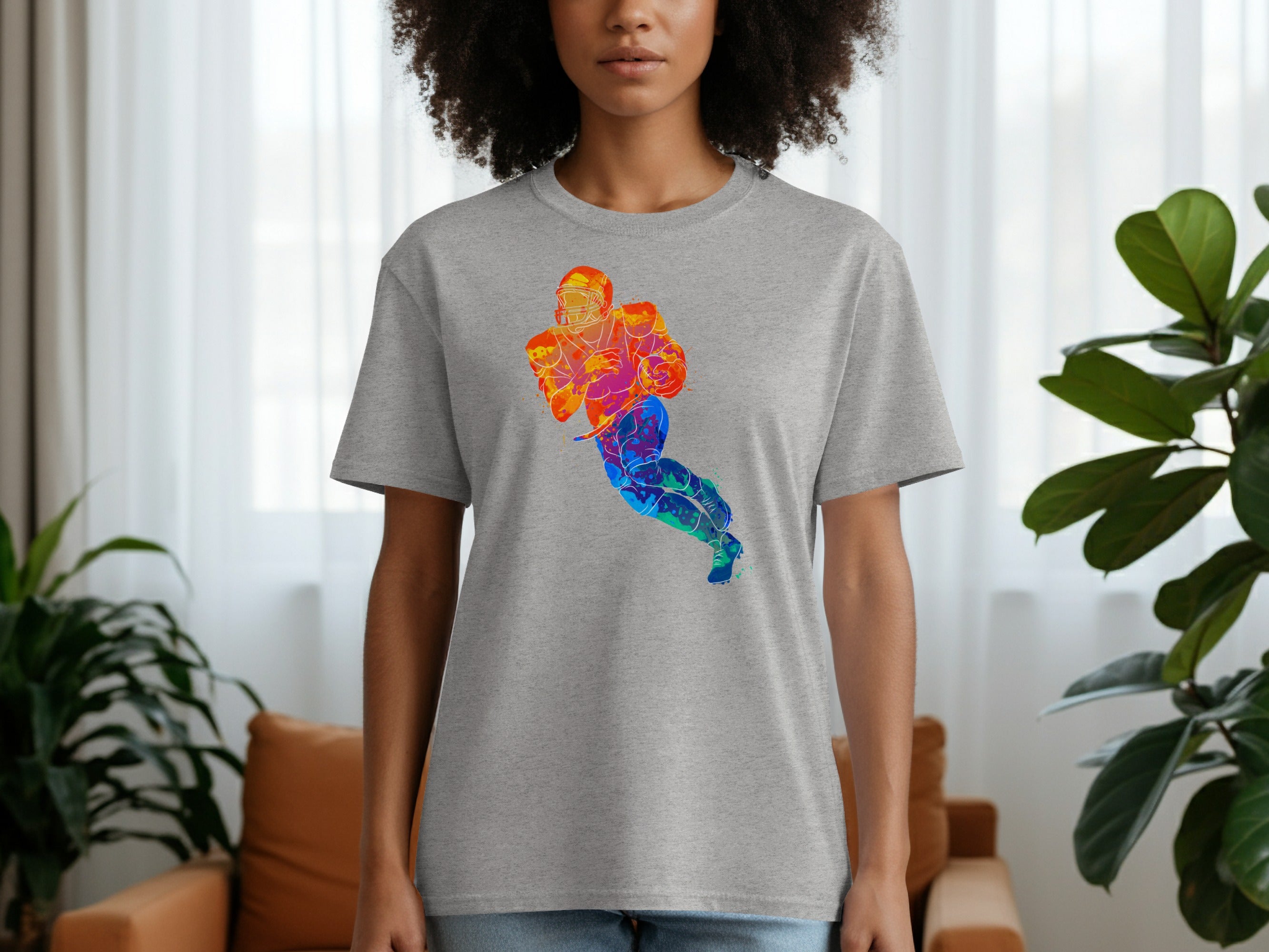 Grey t-shirt with a colorful watercolor football player graphic.