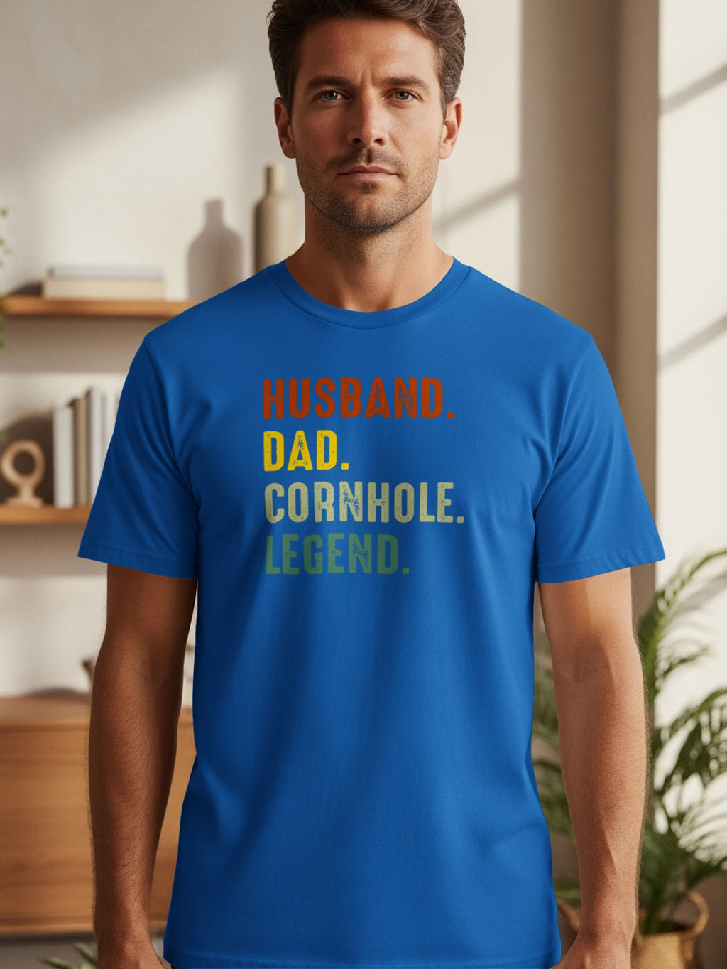 Blue t-shirt with text: Husband. Dad. Cornhole. Legend.