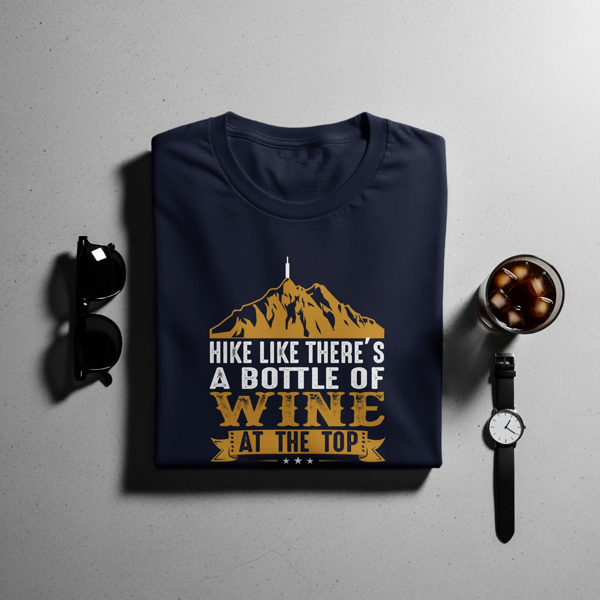 Navy t-shirt with "Hike Like There's A Bottle Of Wine At The Top" graphic.