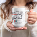 White mug with text "ON TO BE retired COUNTDOWN BEGINS..."