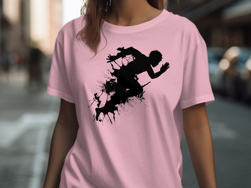 Pink t-shirt with a black silhouette of a runner amidst ink splatters.