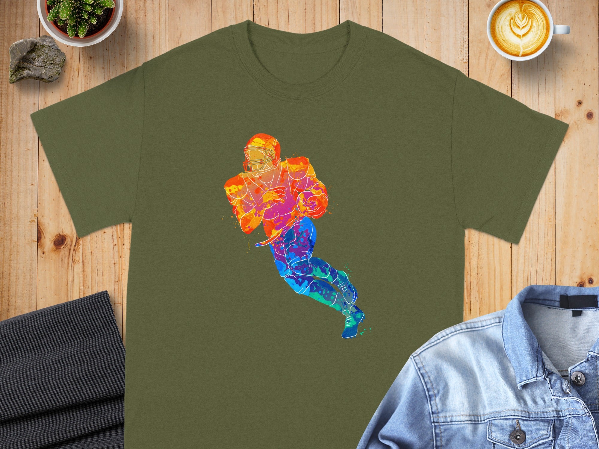 Olive shirt with a colorful watercolor football player design.