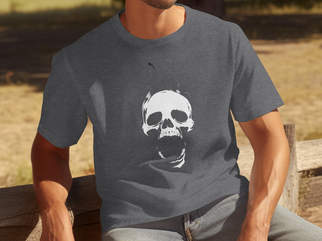 Dark grey t-shirt on a person with a white screaming skull graphic.