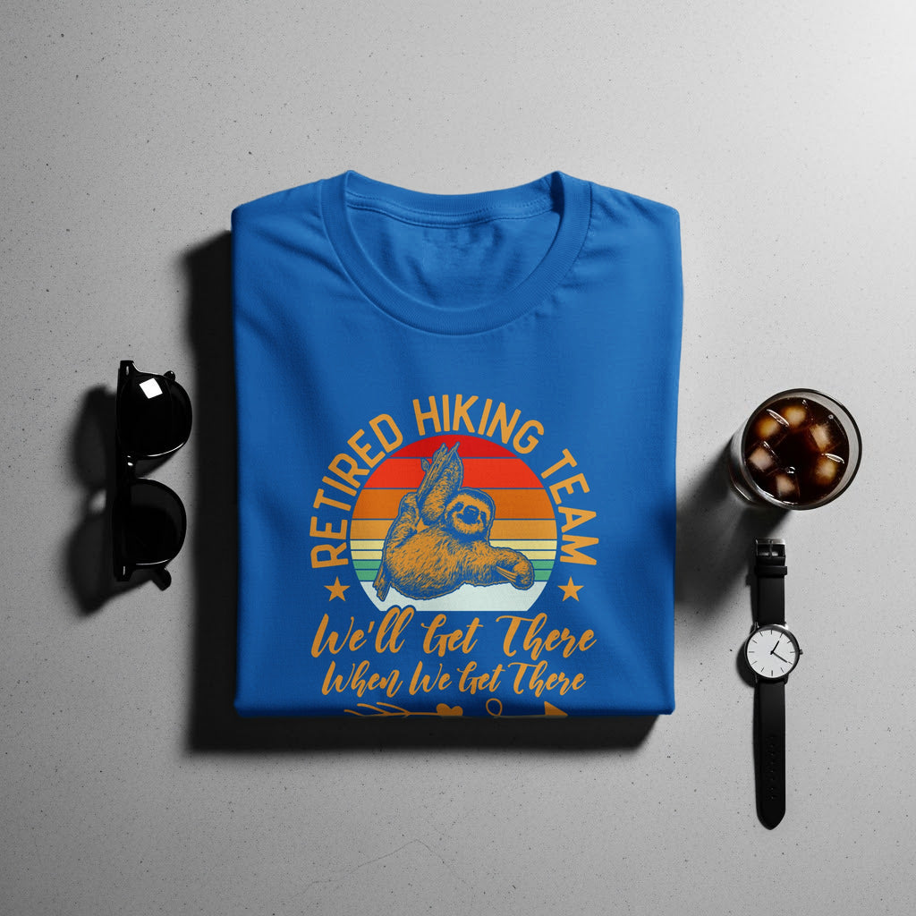 Blue t-shirt with "Retired Hiking Team" graphic featuring a sloth.