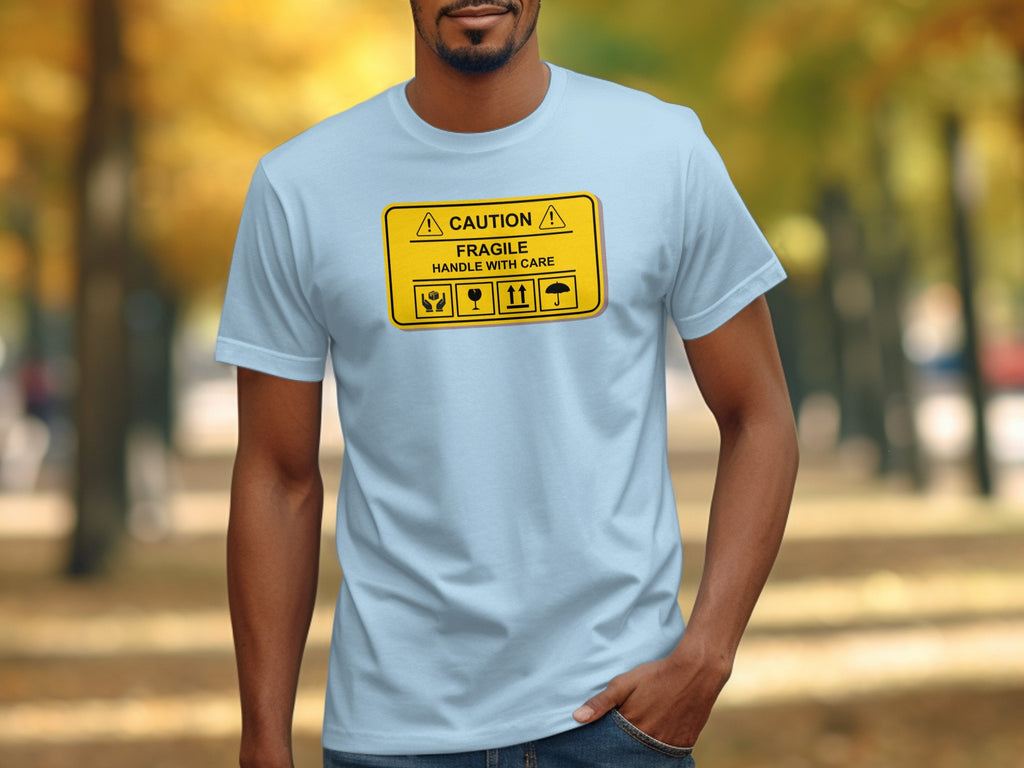Light blue t-shirt with "CAUTION FRAGILE HANDLE WITH CARE" text and shipping icons.