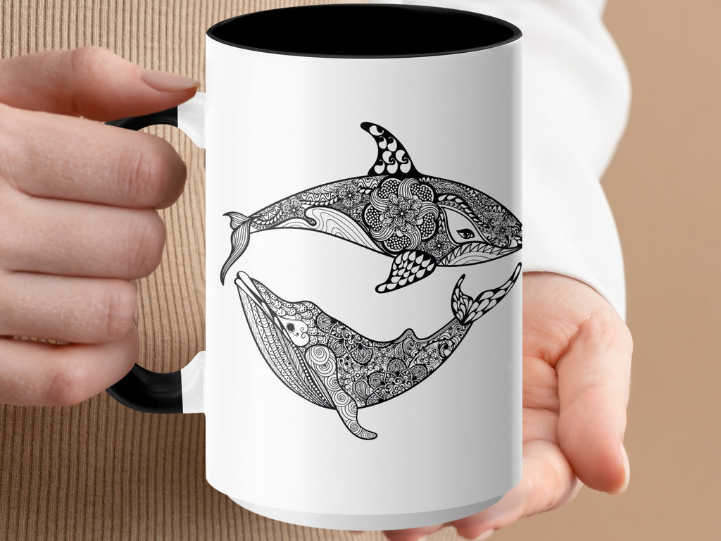 Mug with a black Orca and whale design featuring intricate mandala patterns.
