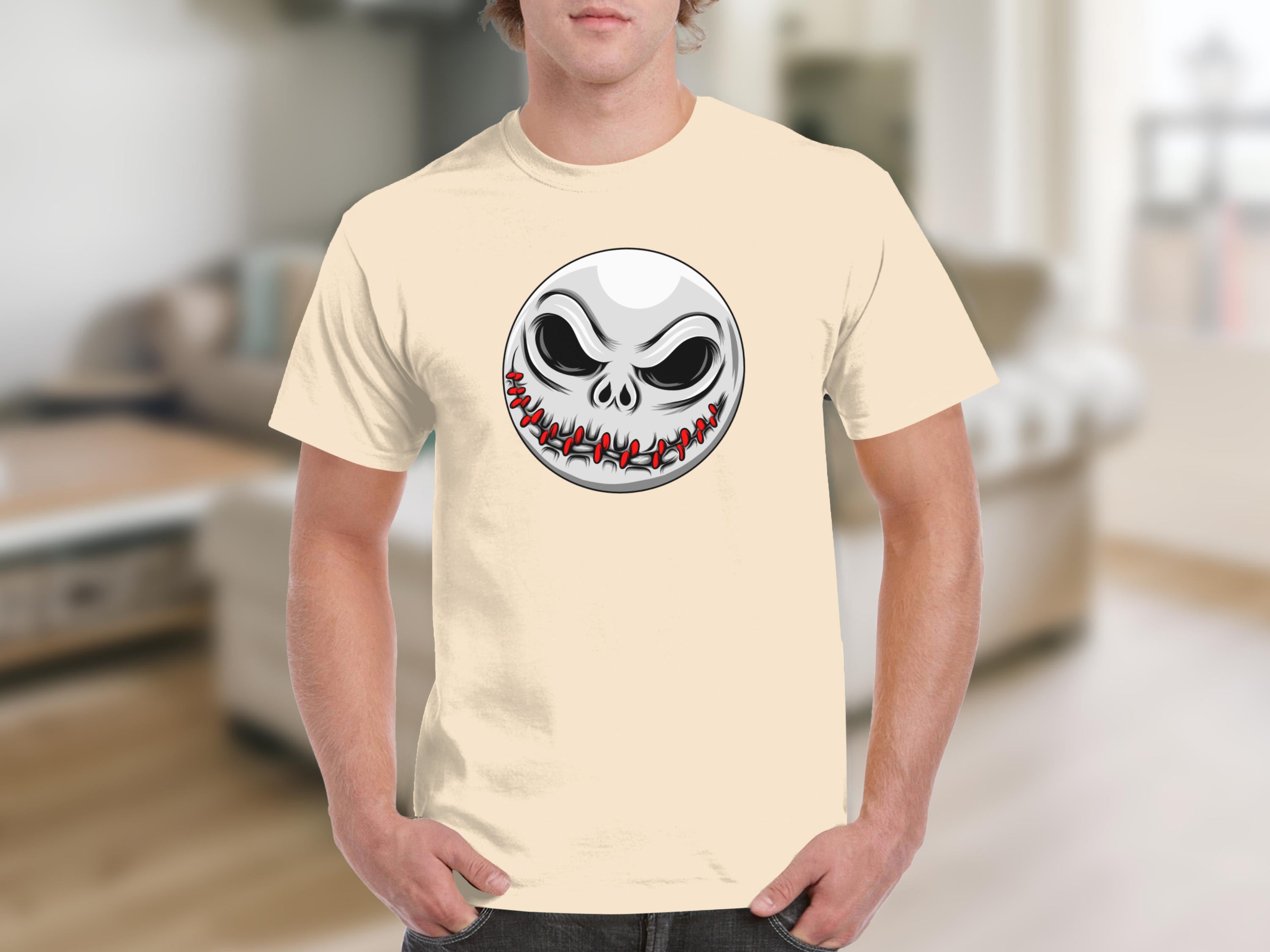 Pale yellow t-shirt featuring a round cartoon jack-o'-lantern face design.