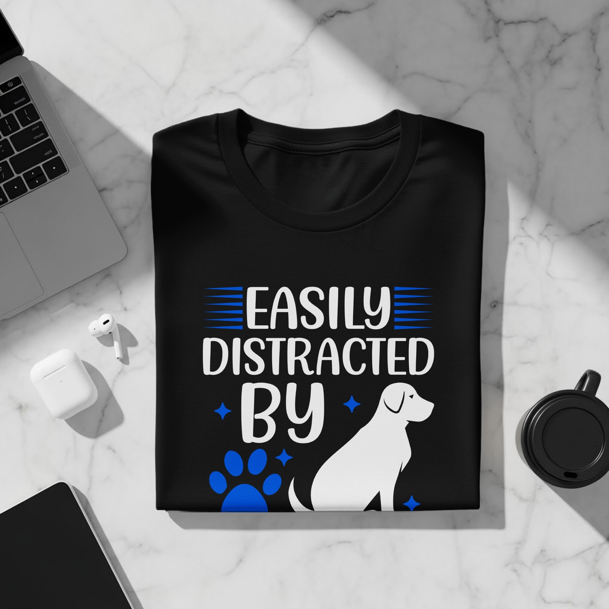 Black t-shirt with "Easily Distracted by" text, paw print, dog, and stars.