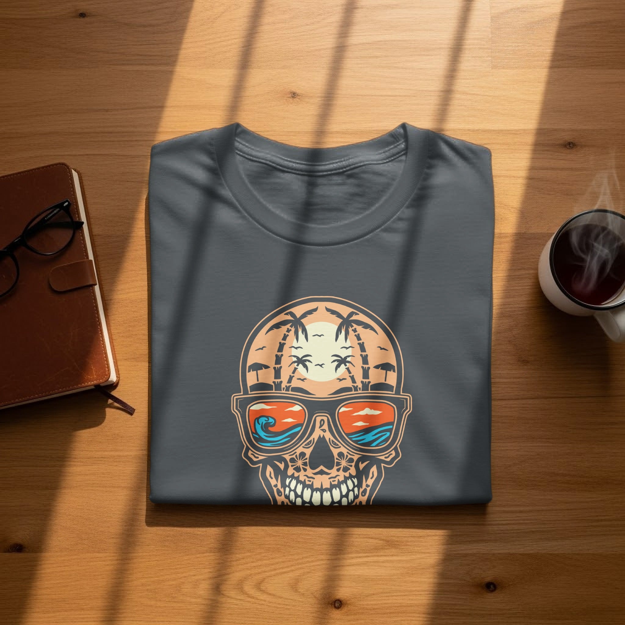 Dark grey t-shirt with a skull graphic wearing sunglasses reflecting a beach scene.