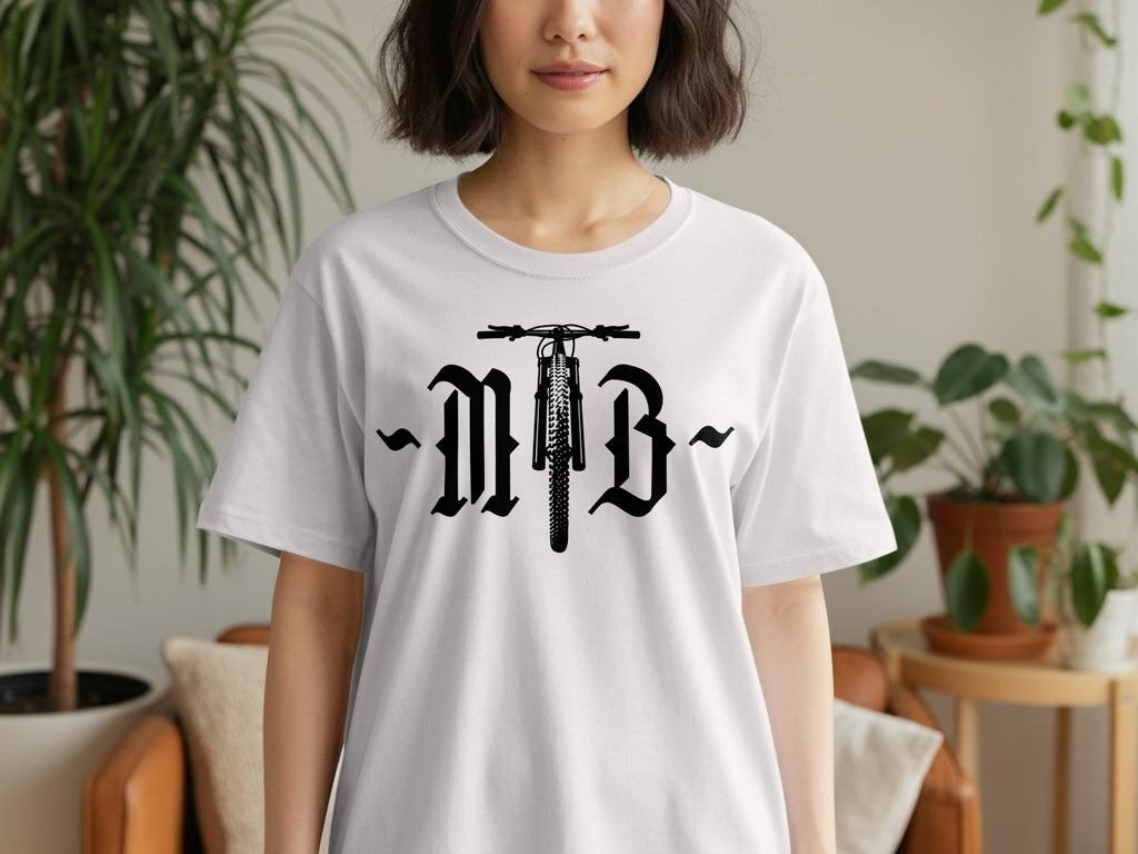 White t-shirt with black MTB graphic featuring a bicycle front wheel and gothic lettering.