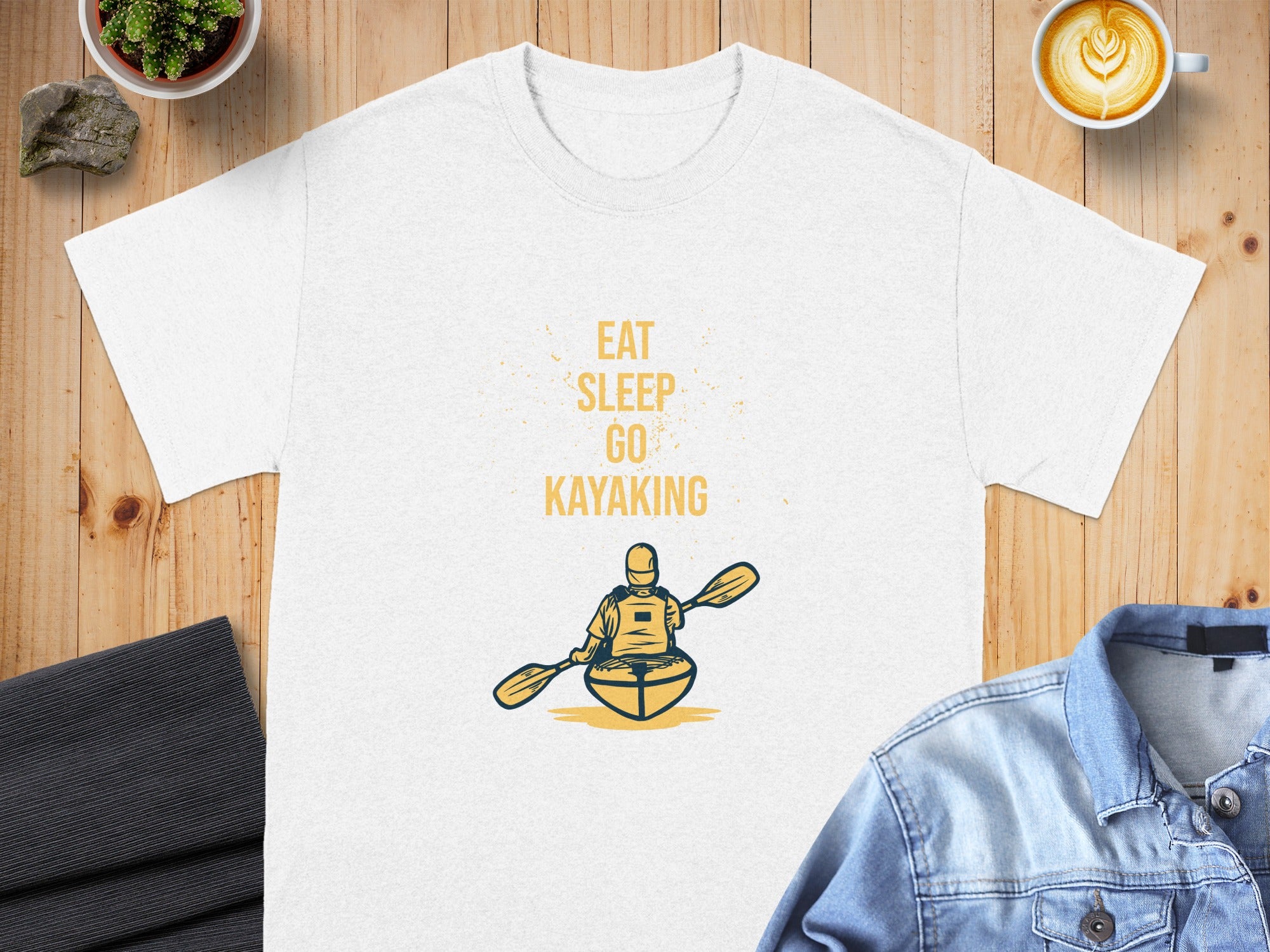 White t-shirt with "Eat Sleep Go Kayaking" text and kayaker graphic.