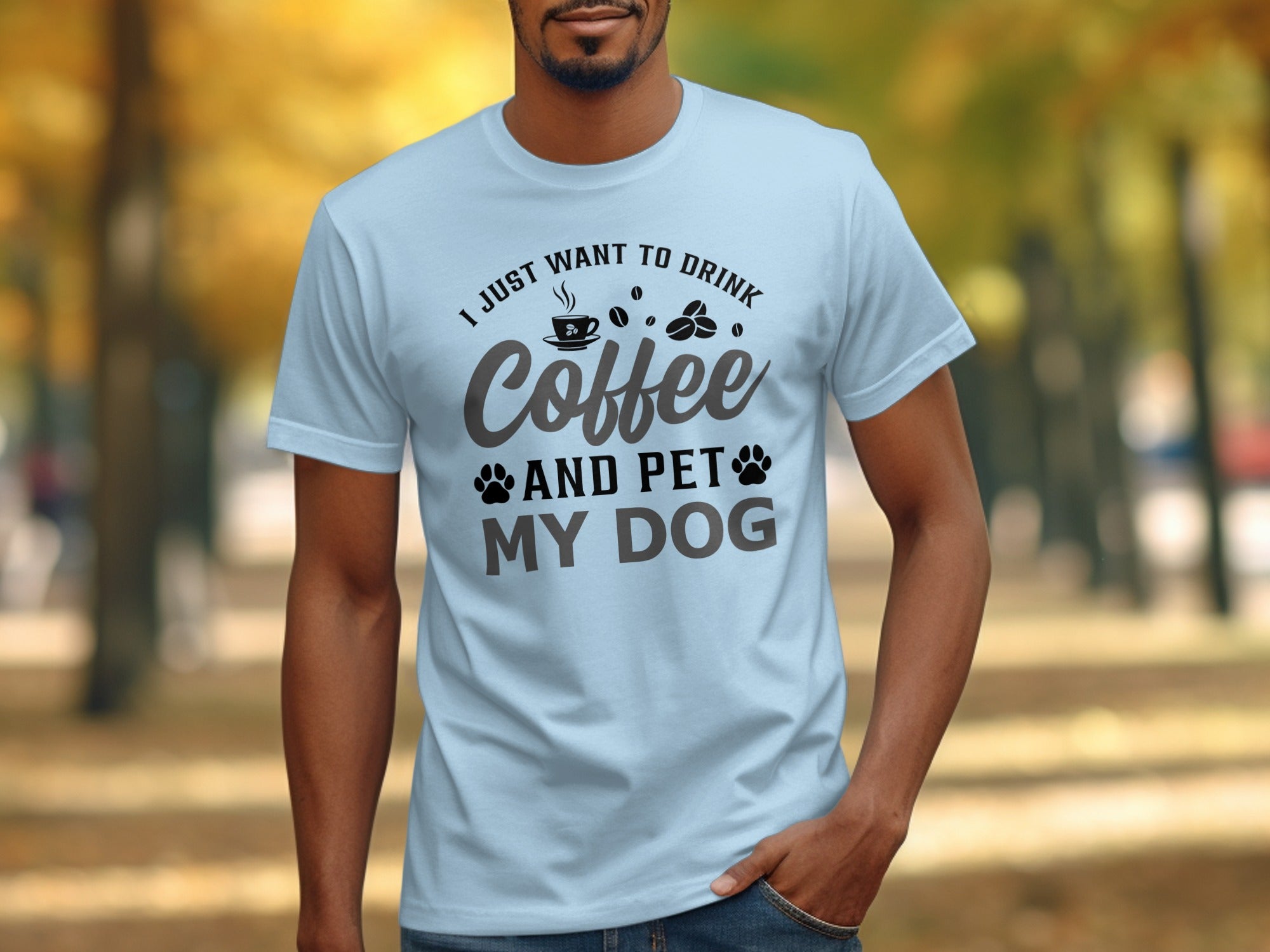 Light blue t-shirt with text "I just want to drink coffee and pet my dog."