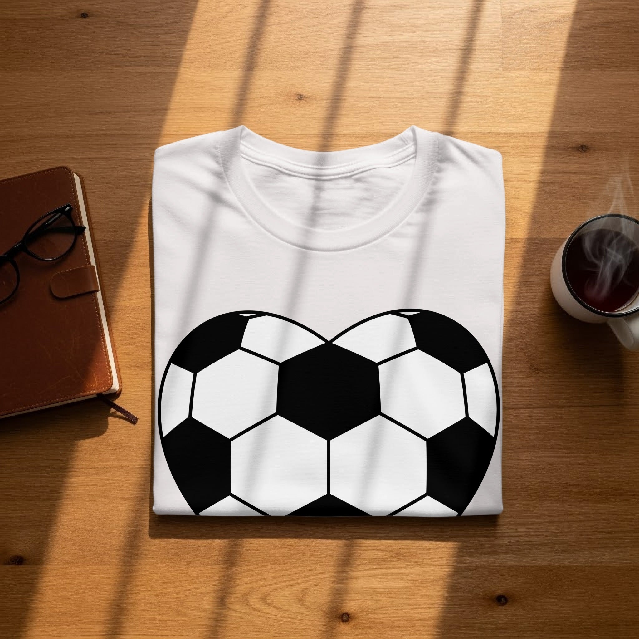 White t-shirt with a black and white soccer ball graphic.