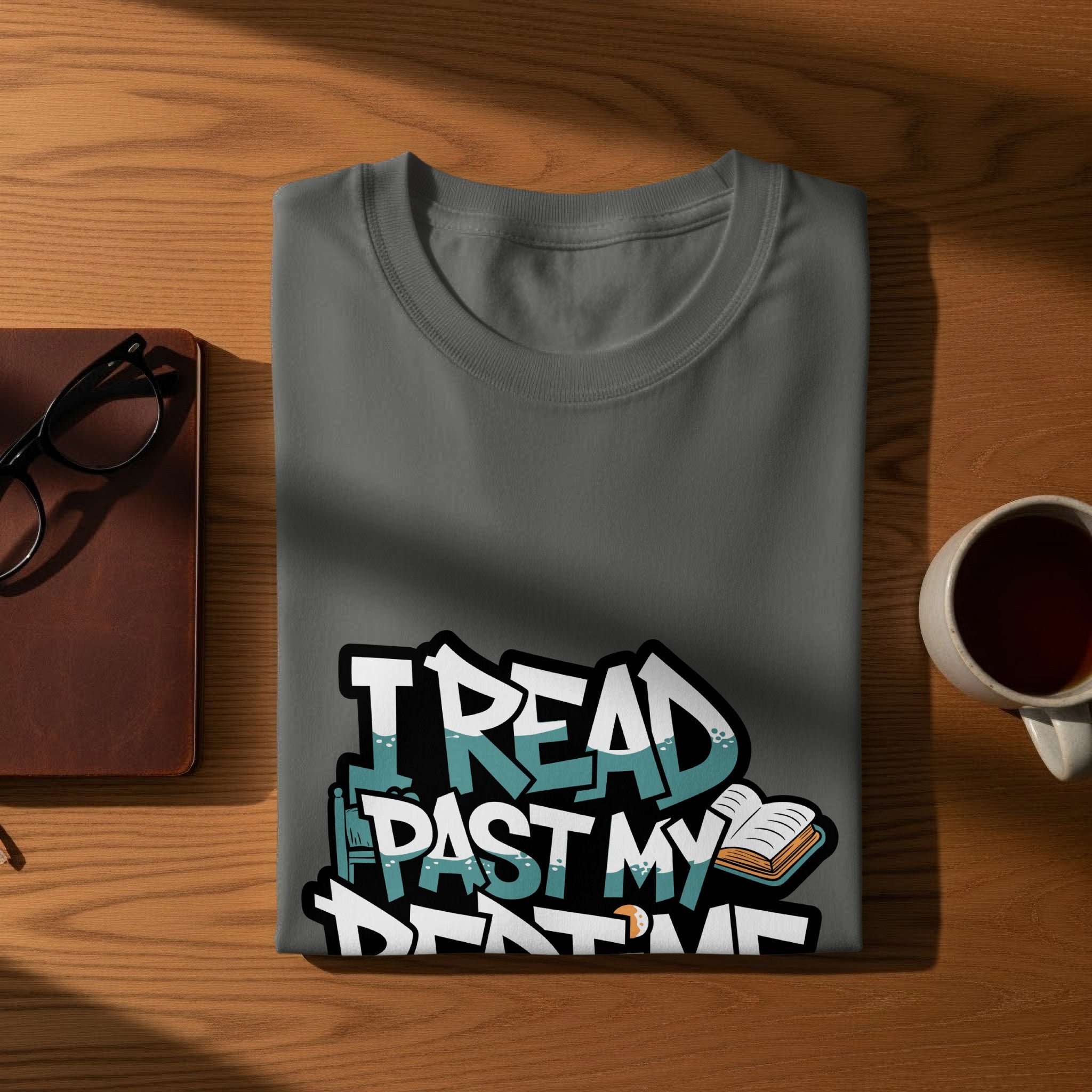 Gray t-shirt with "I READ PAST MY BEDTIME" text and open book graphic.
