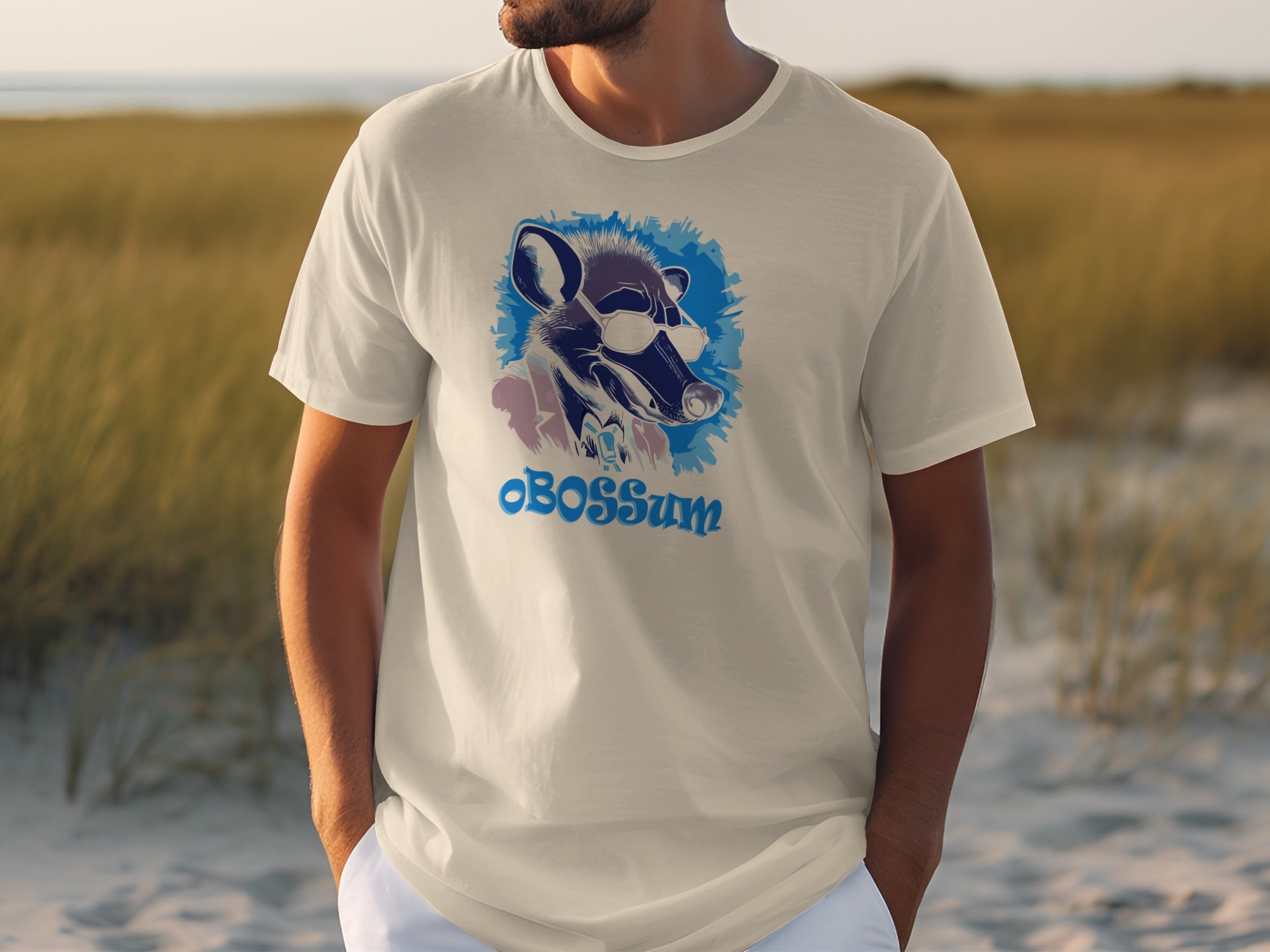 White t-shirt featuring a graphic of an opossum wearing sunglasses with text "oBOSSsum".