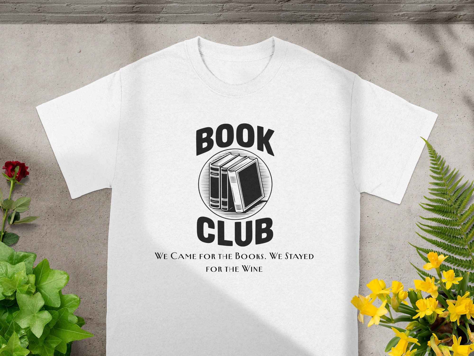 White t-shirt with "BOOK CLUB" and "WE CAME FOR THE BOOKS. WE STAYED FOR THE WINE" text.