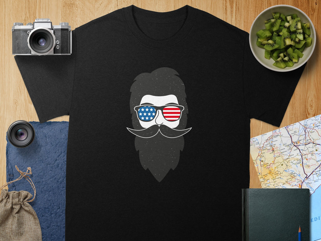 Black t-shirt with distressed graphic of a bearded face in American flag sunglasses.