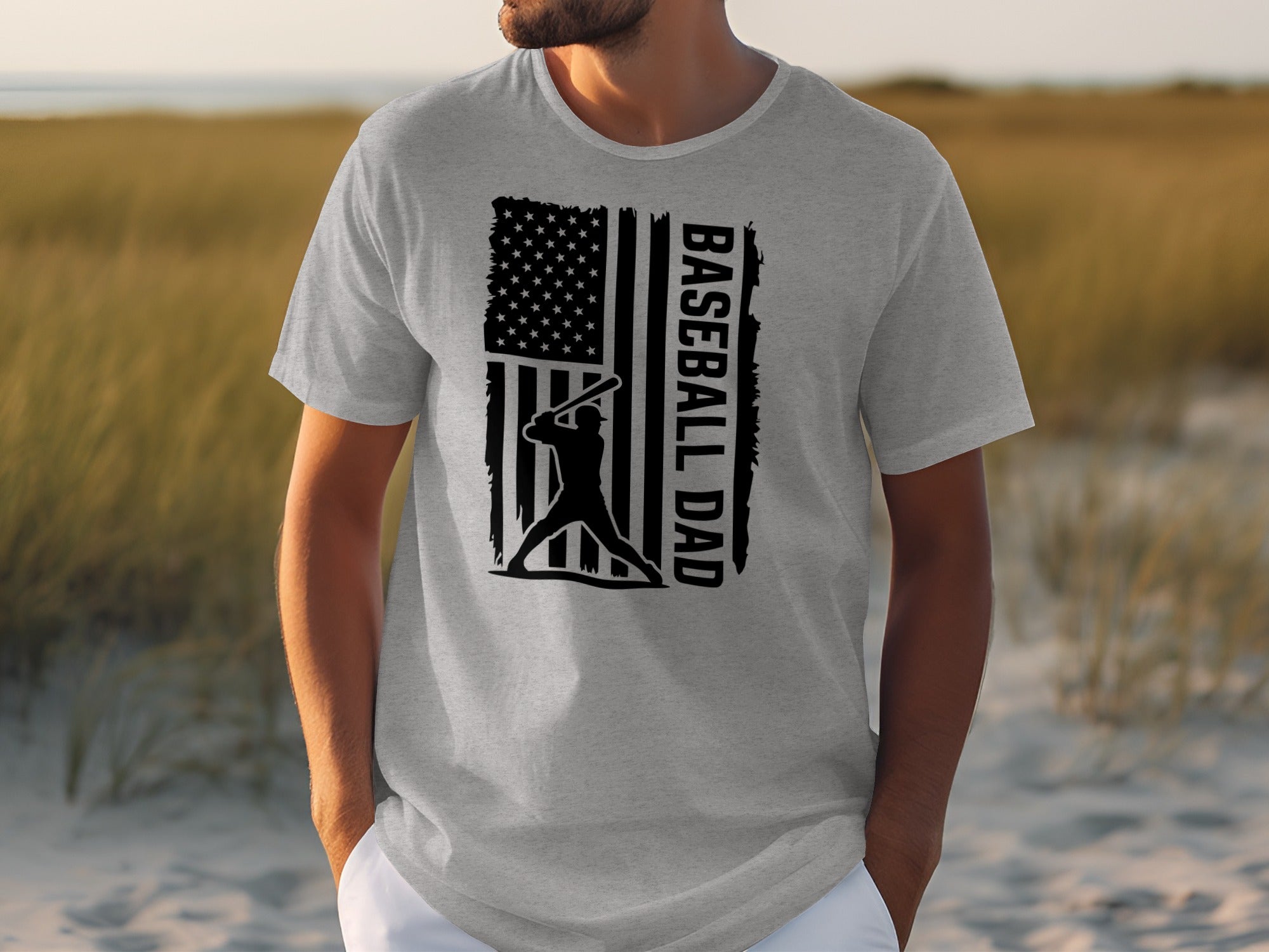 Gray t-shirt with baseball player silhouette, American flag, and text "BASEBALL DAD".