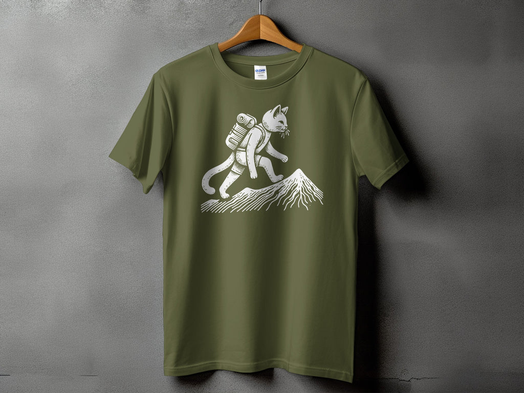 Green t-shirt with white graphic of a cat backpacking up a mountain.