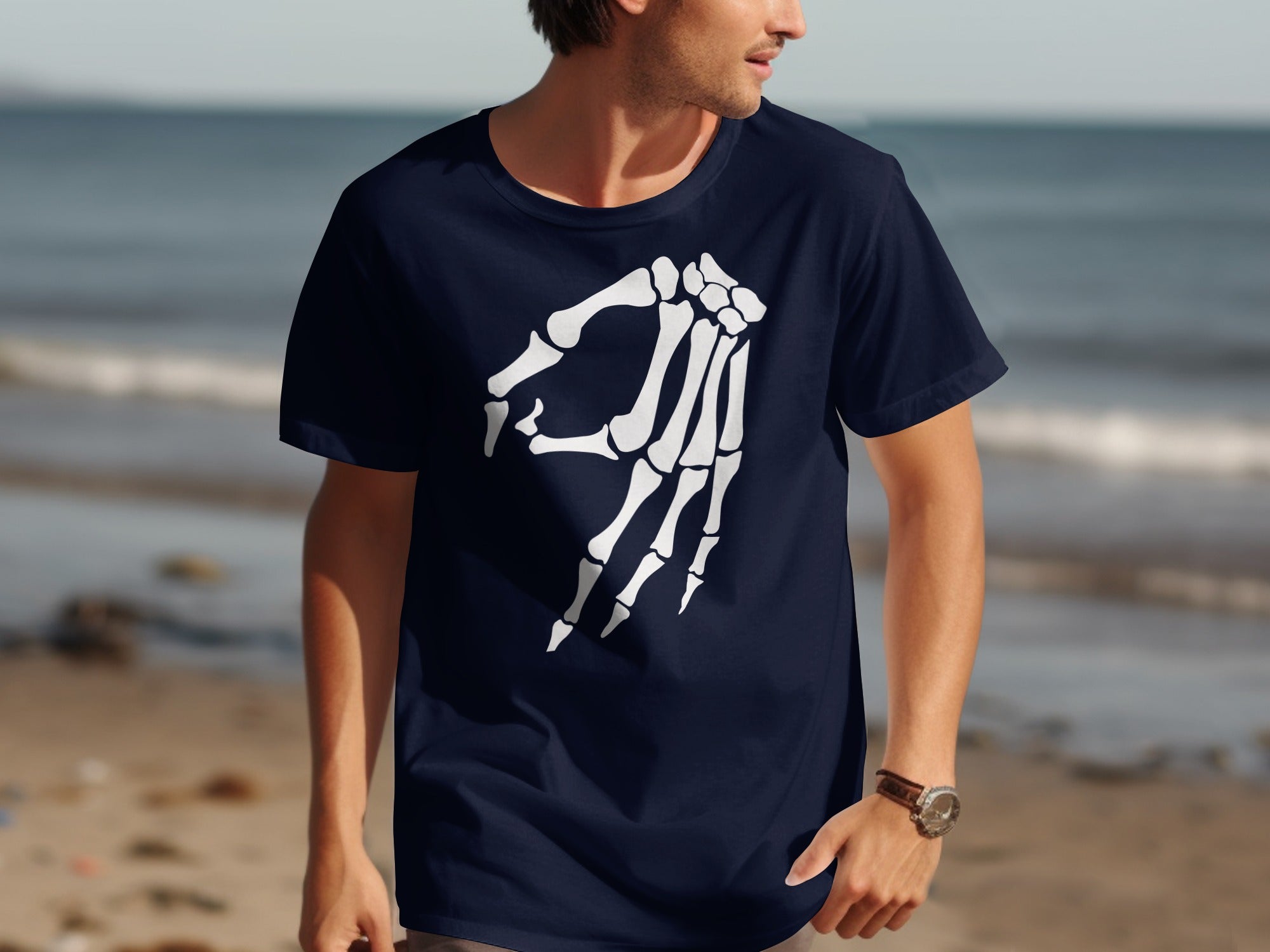 Dark blue t-shirt with white skeleton hand "okay" symbol graphic.
