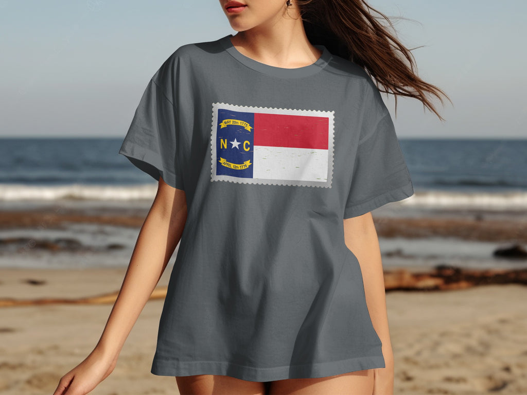 North Carolina flag on a postage stamp design printed on a grey t-shirt.