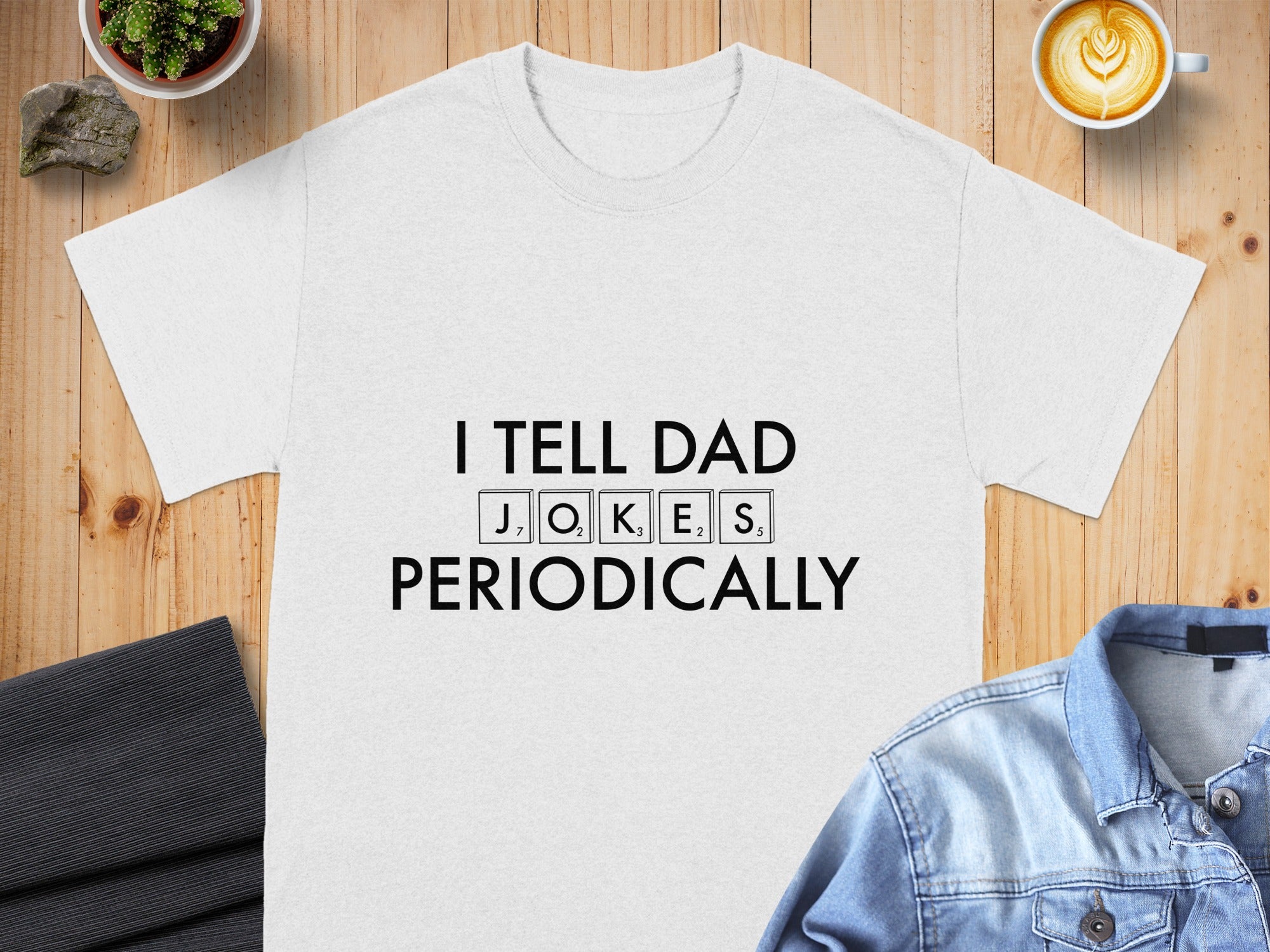 White t-shirt with "I TELL DAD JOKES PERIODICALLY" text.